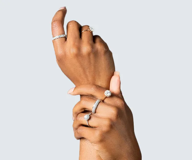 two hands with rings