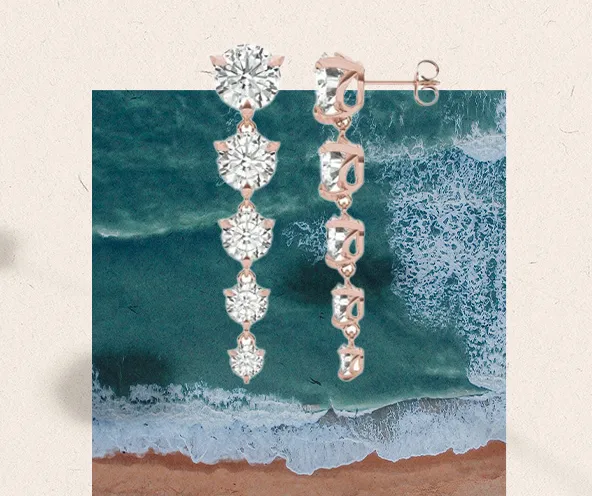 earrings with an ocean behind it