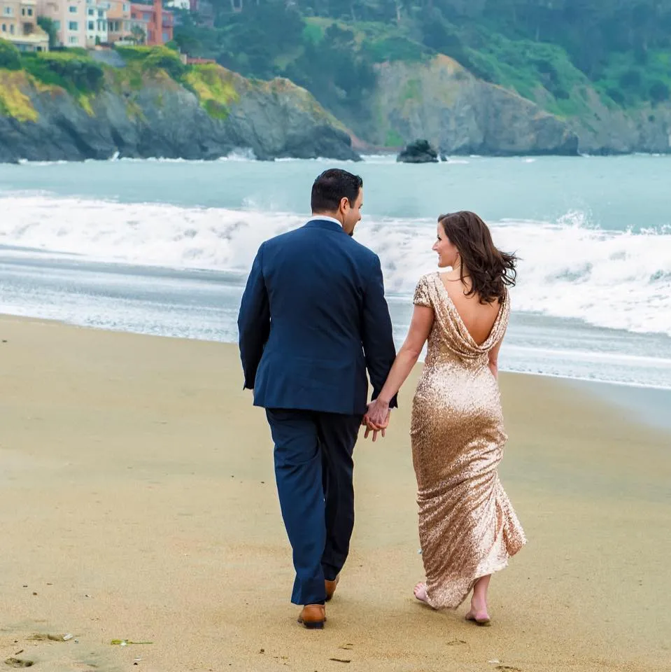 Lynne & Andy Ramirez, founders of LARC Jewels take a romantic stroll along the beach.
