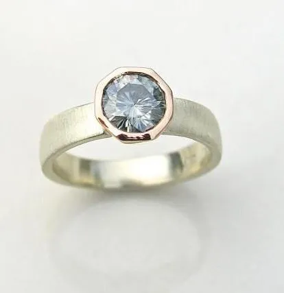 Moissanite is used in so many of my designs. My Steel ring features a beautiful grey moissanite stone