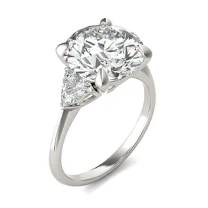 Round Brilliant Claw Prong Trillion Three-Stone image, 